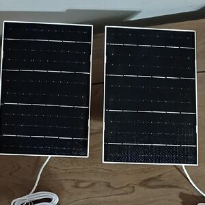 Pair of Black Solar Panels with White Trim